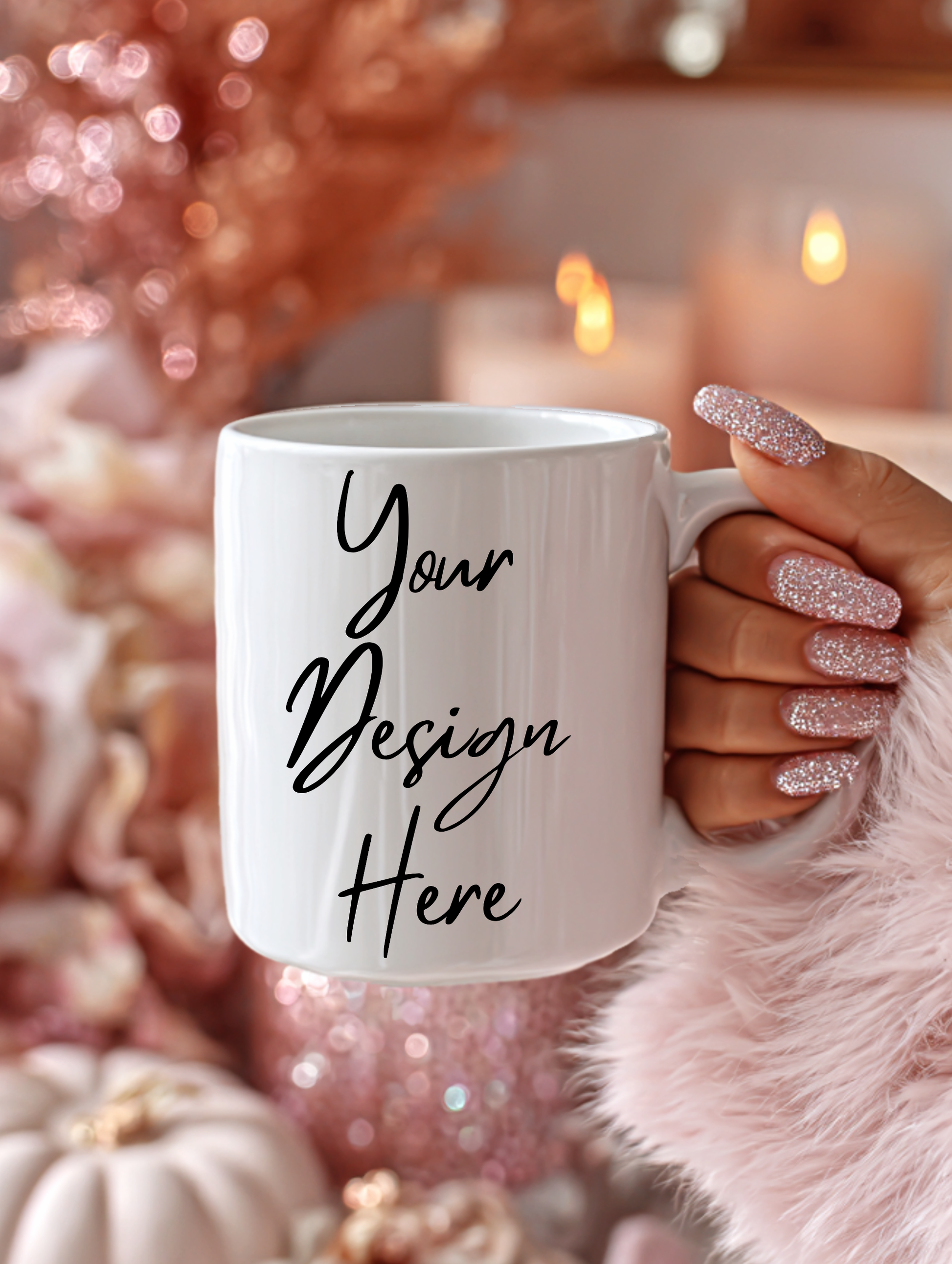 White mug with 'Your Design Here' text held by a hand with glittery nail polish against a festive background.