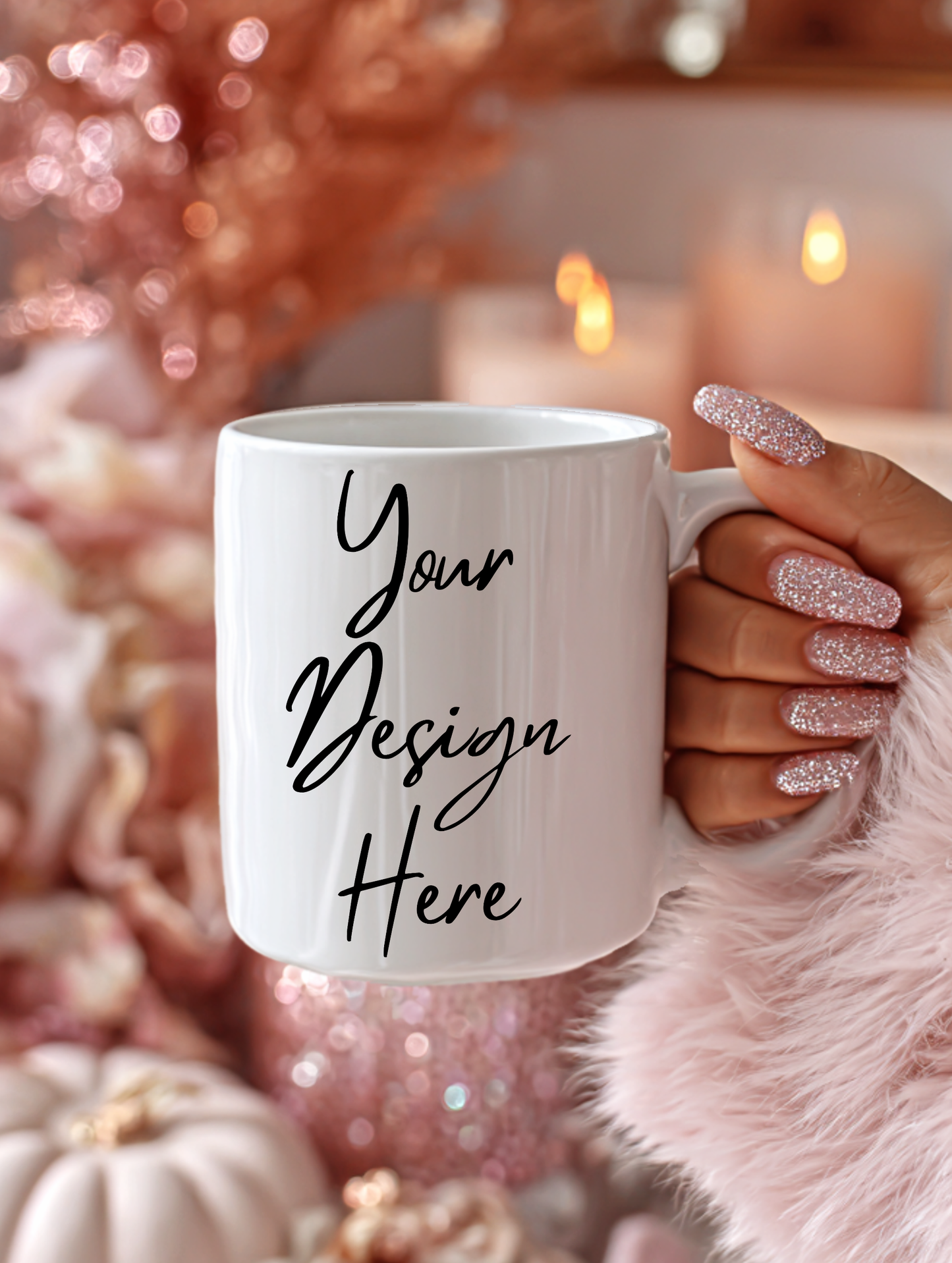 White mug with 'Your Design Here' text held by a hand with glittery nail polish against a festive background.