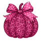 Pink glittery pumpkin with a polka dot bow on a white background
